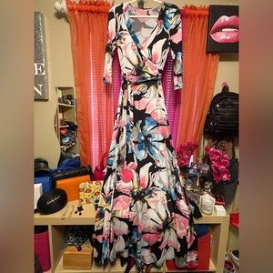 Maxi dress by Janette. Size medium floral print belted, low v neck front.